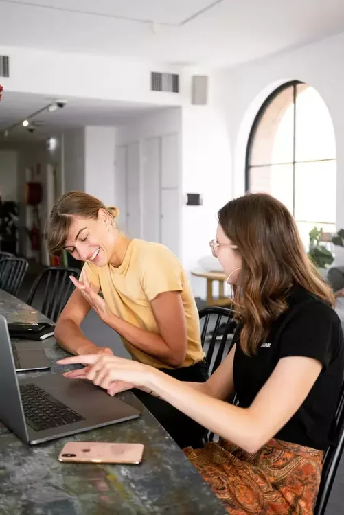 Two bloggers reviewing content opportunities together